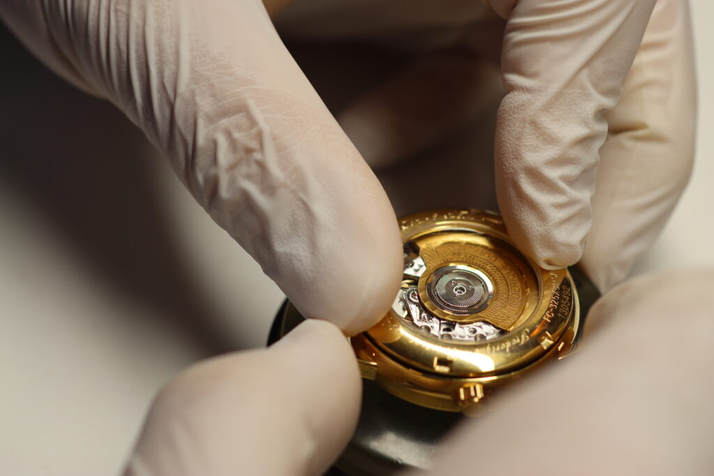 View of the automatic movement of an opened wristwatch